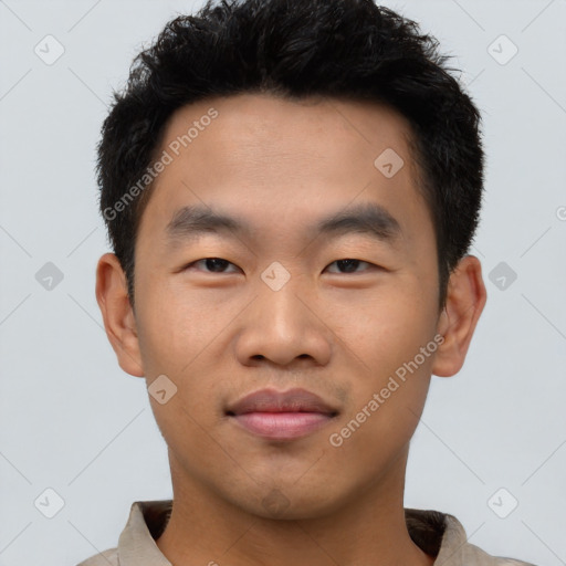 Joyful asian young-adult male with short  black hair and brown eyes