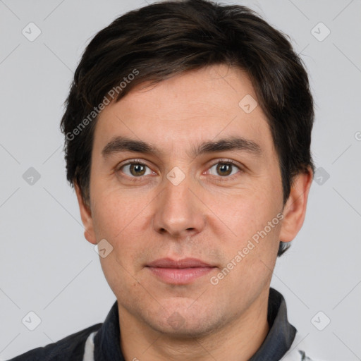 Joyful white adult male with short  brown hair and brown eyes