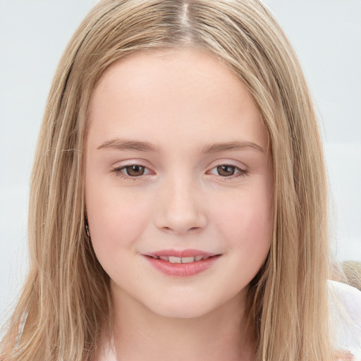 Joyful white child female with long  brown hair and brown eyes