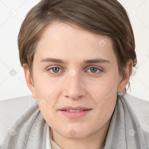 Joyful white young-adult female with medium  brown hair and grey eyes