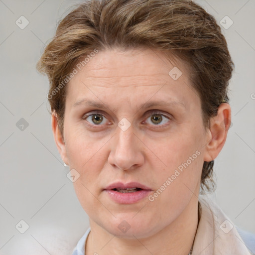 Joyful white adult female with short  brown hair and grey eyes