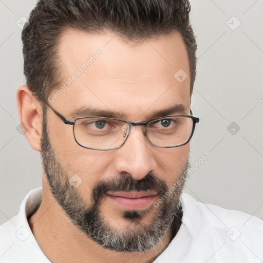 Joyful white adult male with short  brown hair and brown eyes