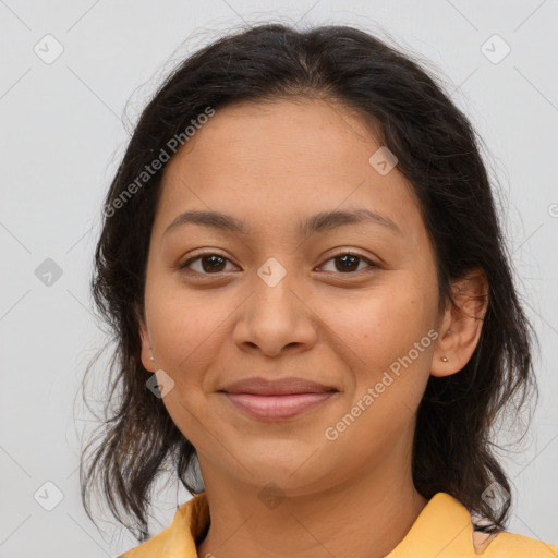 Joyful latino young-adult female with medium  brown hair and brown eyes