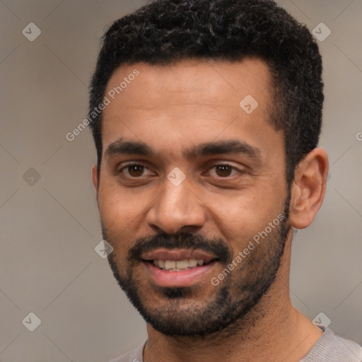 Joyful white young-adult male with short  black hair and brown eyes