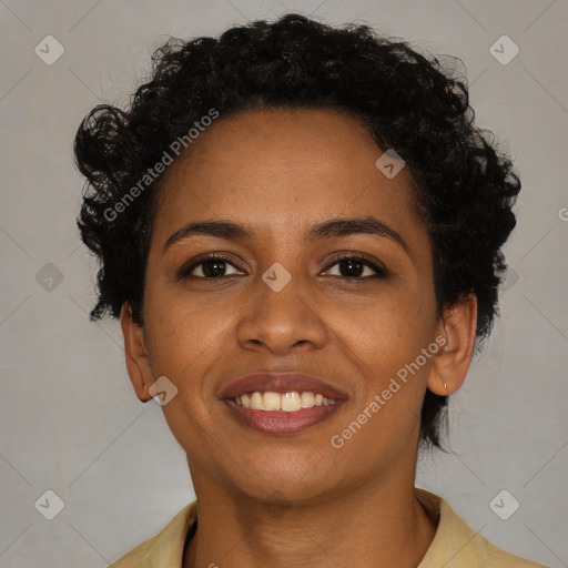 Joyful black young-adult female with short  brown hair and brown eyes