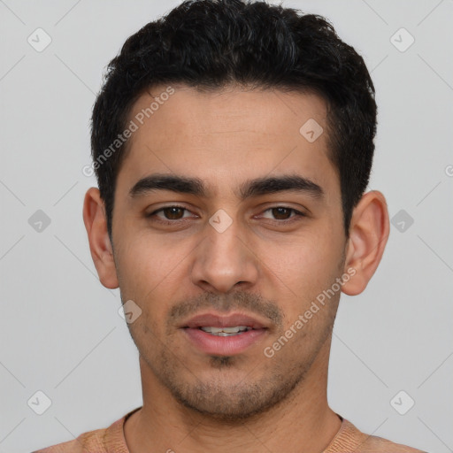 Joyful white young-adult male with short  black hair and brown eyes