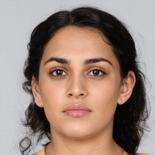 Neutral latino young-adult female with medium  brown hair and brown eyes