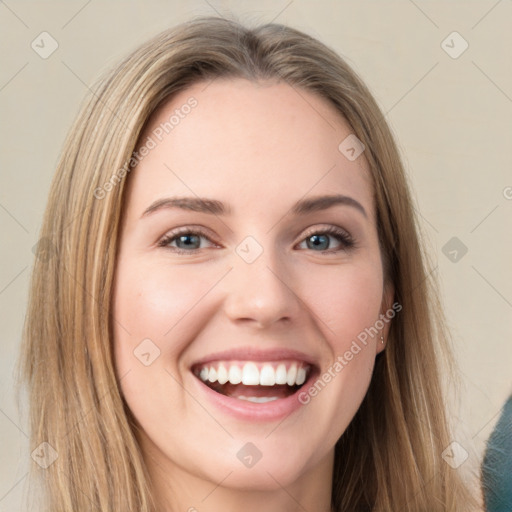 Joyful white young-adult female with long  brown hair and grey eyes