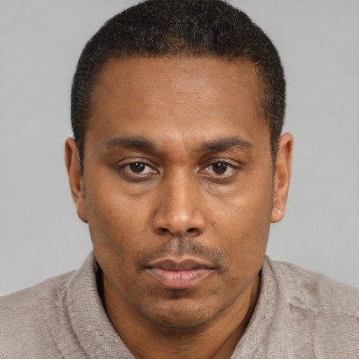 Neutral latino young-adult male with short  brown hair and brown eyes