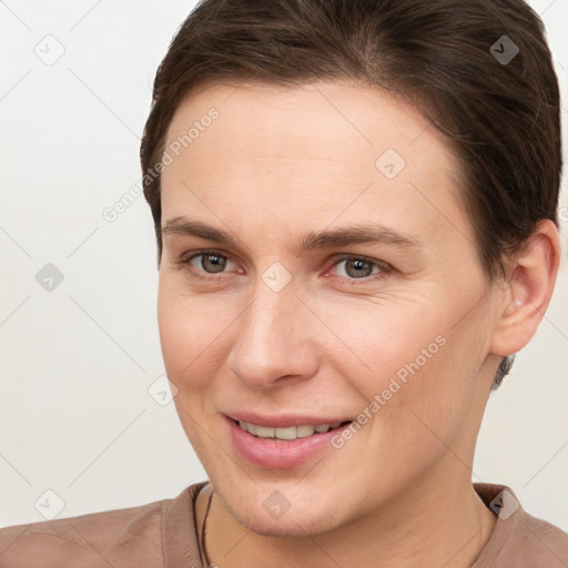 Joyful white young-adult female with short  brown hair and brown eyes