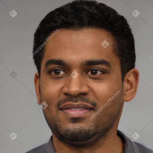 Joyful black young-adult male with short  black hair and brown eyes