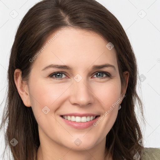 Joyful white young-adult female with long  brown hair and grey eyes