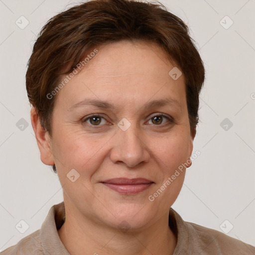 Joyful white adult female with short  brown hair and grey eyes