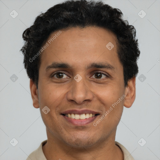 Joyful latino young-adult male with short  brown hair and brown eyes