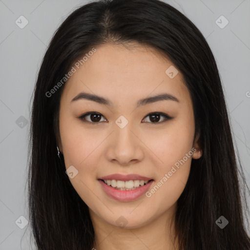 Joyful asian young-adult female with long  brown hair and brown eyes