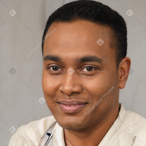 Joyful latino young-adult male with short  black hair and brown eyes