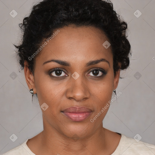 Joyful black young-adult female with short  brown hair and brown eyes