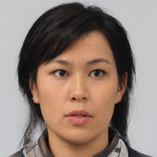 Neutral asian young-adult female with medium  brown hair and brown eyes