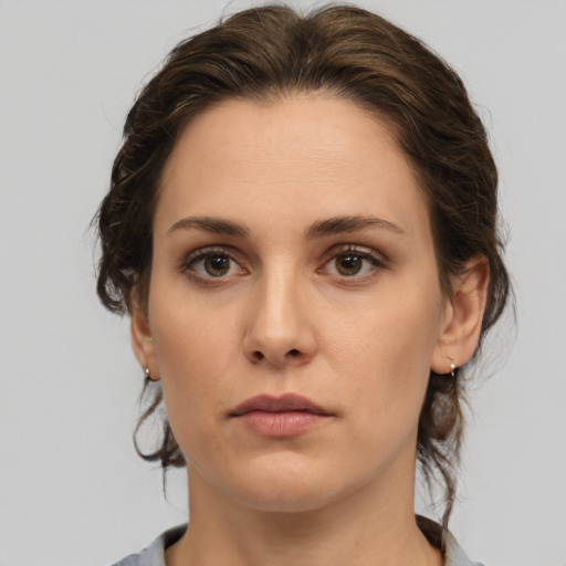 Neutral white young-adult female with medium  brown hair and brown eyes