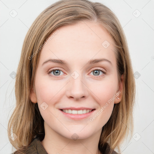 Joyful white young-adult female with long  brown hair and blue eyes