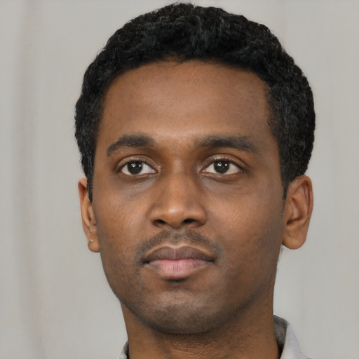 Neutral black young-adult male with short  black hair and brown eyes