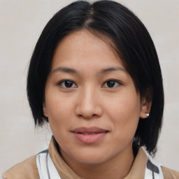 Joyful asian young-adult female with medium  black hair and brown eyes