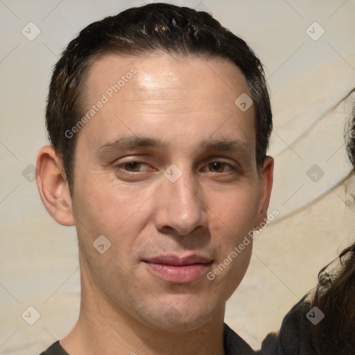 Joyful white adult male with short  brown hair and brown eyes