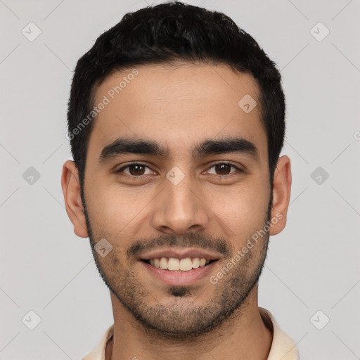 Joyful latino young-adult male with short  black hair and brown eyes