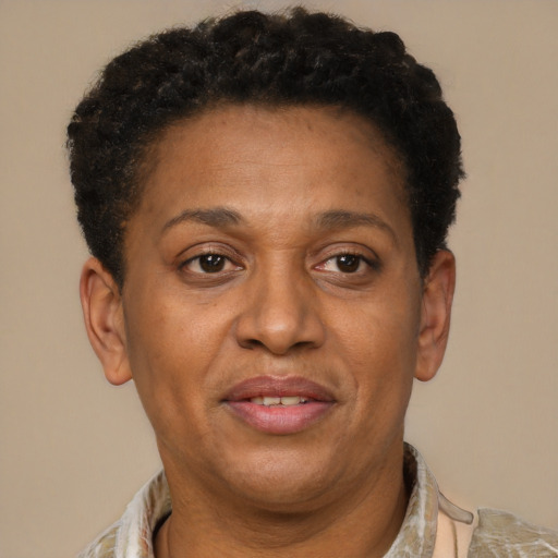 Joyful latino adult female with short  brown hair and brown eyes
