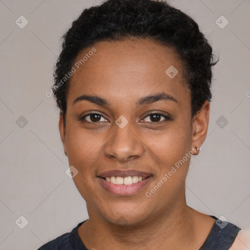 Joyful black young-adult female with short  black hair and brown eyes