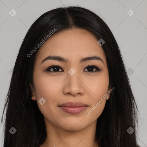 Joyful latino young-adult female with long  black hair and brown eyes