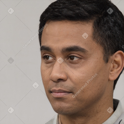 Neutral latino young-adult male with short  black hair and brown eyes