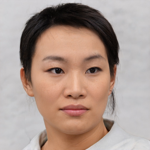 Neutral asian young-adult female with short  brown hair and brown eyes
