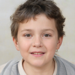 Joyful white child male with short  brown hair and brown eyes