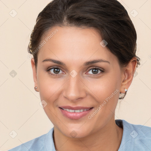 Joyful white young-adult female with short  brown hair and brown eyes