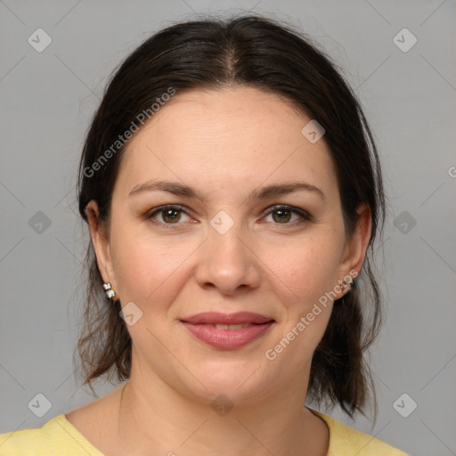 Joyful white adult female with medium  brown hair and brown eyes