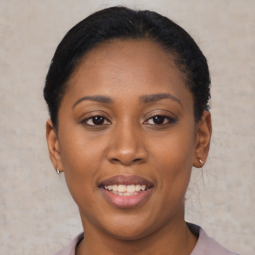 Joyful latino young-adult female with short  black hair and brown eyes