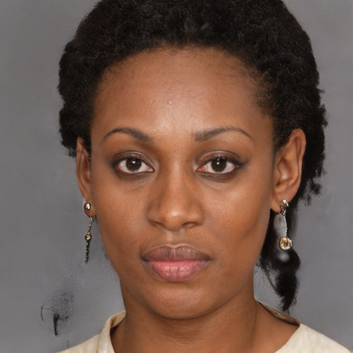 Neutral black adult female with short  brown hair and brown eyes
