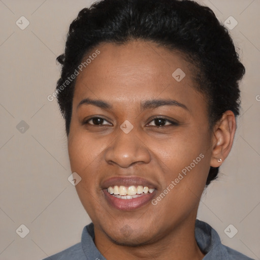 Joyful black young-adult female with short  black hair and brown eyes