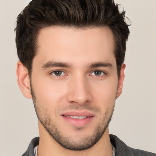 Joyful white young-adult male with short  brown hair and brown eyes