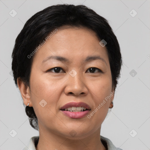 Joyful asian adult female with short  brown hair and brown eyes