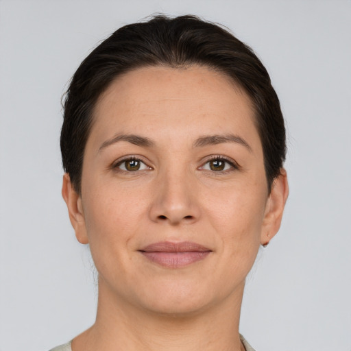 Joyful white young-adult female with short  brown hair and brown eyes