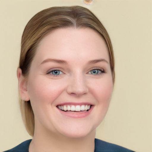 Joyful white young-adult female with medium  brown hair and blue eyes