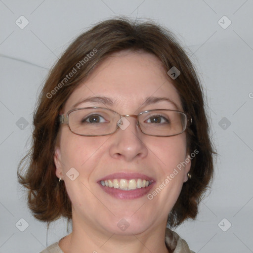 Joyful white adult female with medium  brown hair and blue eyes