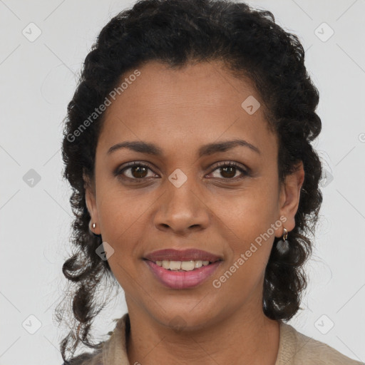 Joyful black young-adult female with long  brown hair and brown eyes