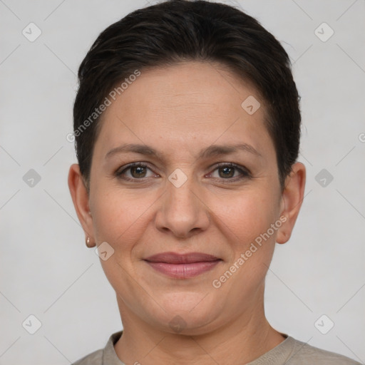 Joyful white adult female with short  brown hair and brown eyes