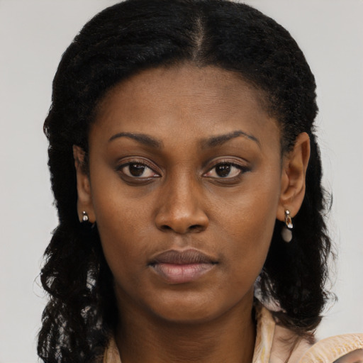 Neutral black young-adult female with long  brown hair and brown eyes