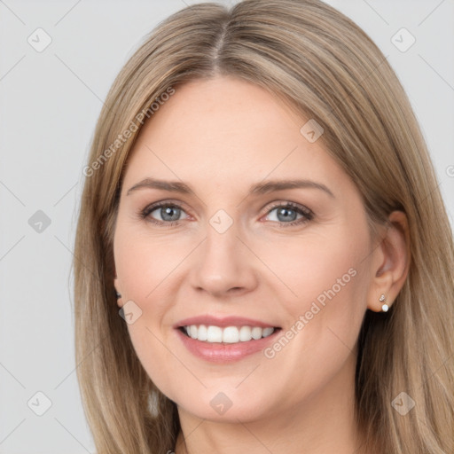 Joyful white young-adult female with long  brown hair and grey eyes