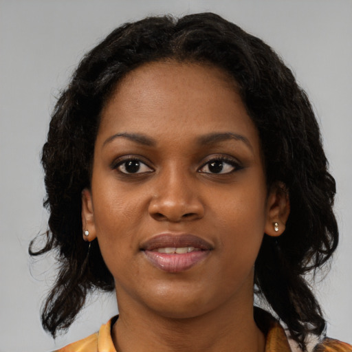 Joyful black young-adult female with medium  black hair and brown eyes