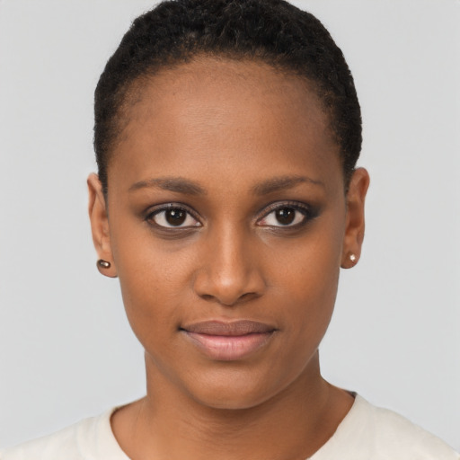 Joyful black young-adult female with short  brown hair and brown eyes
